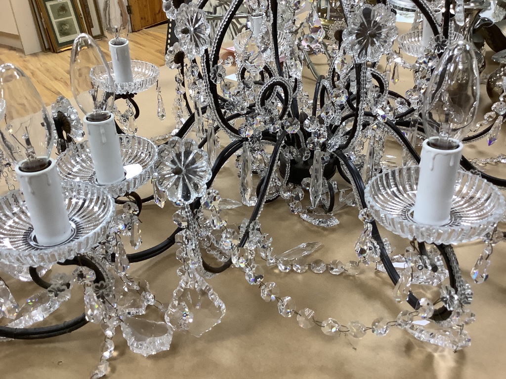 A pair of gilt metal and cut crystal chandeliers